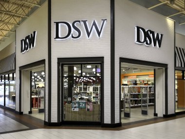 Toronto, Canada - June 4, 2019: DSW storefront in the in Vaughan Mills mall in Toronto. DSW is an American footwear retailer of designer and name brand shoes and fashion accessories. clipart