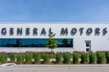 Oshawa, Ontario, Canada - July 1, 2019: Sign Of General Motors on the building of Canadian Technical centre in Oshawa, Ontario, Canada. clipart