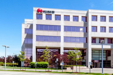 Markham, Ontario, Canada - June 3, 2019: Huawei Technologies Canada office building in Markham, Ontario, Canada, a Chinese networking, telecommunications equipment, and services company. clipart