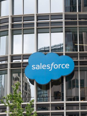 San Francisco, California, USA - June 6, 2023: Salesforce logo on the building at the headquarters in San Francisco, California, USA. Salesforce, Inc. is an American cloud-based software company. clipart