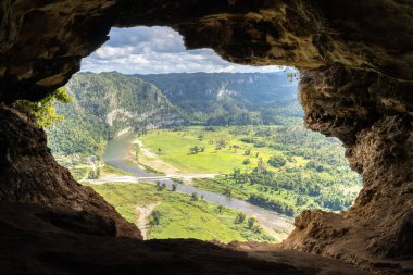 Cueva Ventana (Cave Window) overlooking the Ro Grande de Arecibo valley, Cave Window is a large cave situated a top a limestone cliff in Arecibo, Puerto Rico. clipart