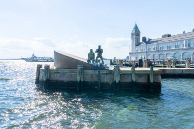 New York City, USA - August 19, 2022: American Merchant Mariners Memorial sculpture by artist Marisol Escobar, located on the west side of Battery Park, New York City, USA. clipart