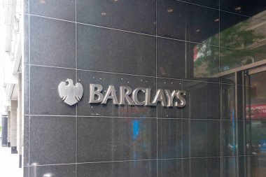 New York, NY, USA - August 17, 2022: Barclays logo sign at the entrance to the office building in New York, NY, USA clipart