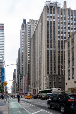 New York City, USA - August 18, 2022: Street view of 6th Ave. looking North at Midtown Manhattan near Radio City Music Hall in New York City, USA. clipart