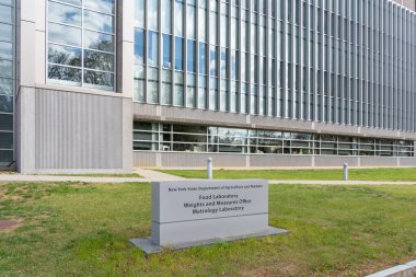 New York State Food Laboratory and Weights and Measures Division office building on Harriman Research and Technology Campus in Albany, New York, USA, November 12, 2023. clipart