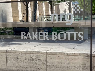 Houston, Texas, USA - April 4, 2024: The signage for nrg and BAKER BOTTS outside their office in Houston, Texas, USA. clipart