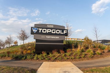 Topgolf sign is seen in King of Prussia, PA, USA, November 5, 2023. Topgolf is a sprawling entertainment venue with a high-tech driving range and swanky lounge with drinks and games. clipart