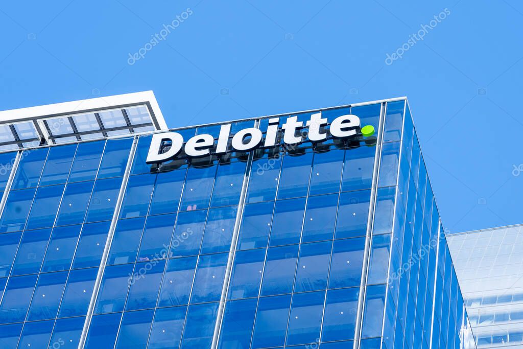 Auckland, New Zealand - February 1, 2024: Deloitte logo sign on the office building in Auckland, New Zealand. Deloitte is a multinational professional services network.