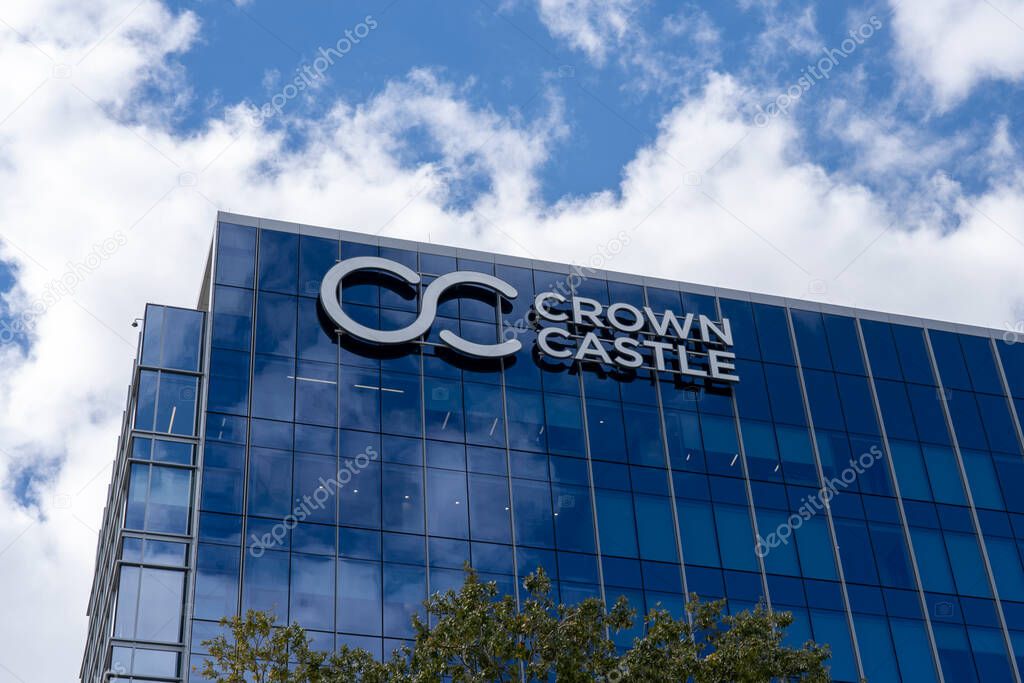 Houston, TX, USA - February 15, 2022: Crown Castle sign at its headquarters in Houston, TX, USA. Crown Castle is a real estate investment trust and provider of shared communications infrastructure.