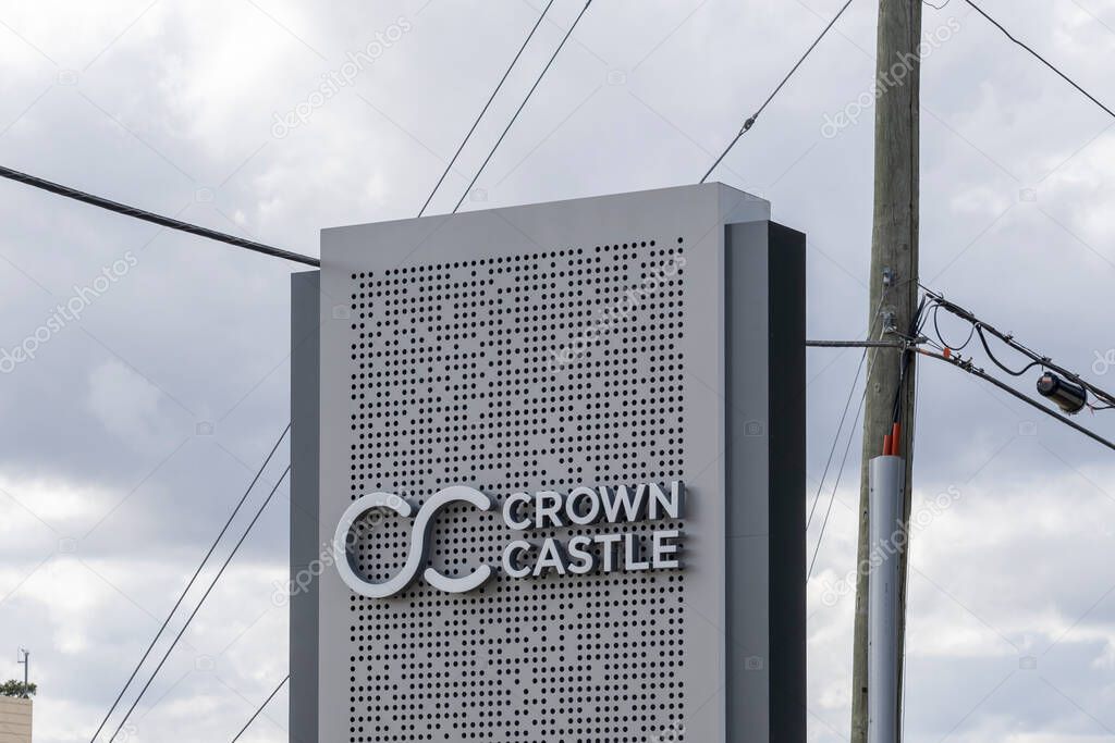 Houston, TX, USA - February 15, 2022: Crown Castle sign at its headquarters in Houston, TX, USA. Crown Castle is a real estate investment trust and provider of shared communications infrastructure.