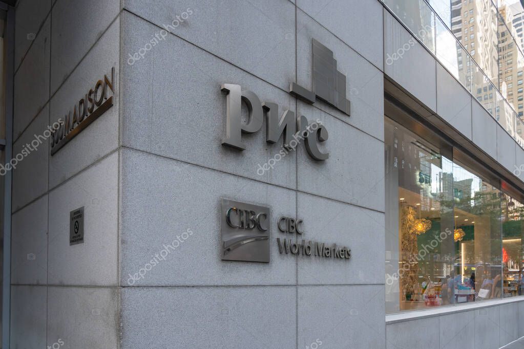 New York City, USA - August 18, 2022: PricewaterhouseCoopers (PwC) and CIBC World Markets logos on the office building on Madison Ave. in New York City.