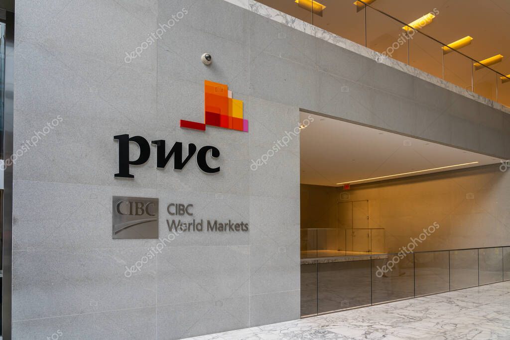 New York City, USA - August 17, 2022: PricewaterhouseCoopers (PwC) and CIBC World Markets logos on the office building on Madison Ave. in New York City.