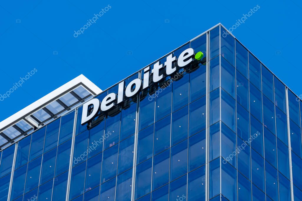 Auckland, New Zealand - February 1, 2024: Deloitte logo sign on the office building in Auckland, New Zealand. Deloitte is a multinational professional services network.