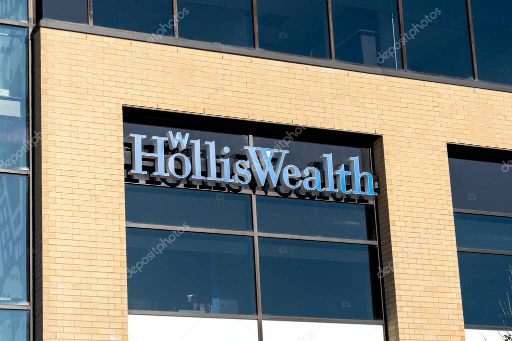 Waterloo, Ontario, Canada - October 17, 2020: HollisWealth company sign on the Building in Waterloo, Ontario, Canada. HollisWealth is Canada's premier financial advisory networks.