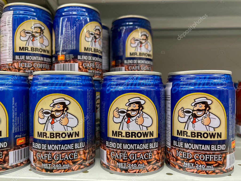 Calgary, Alberta, Canada - July 18, 2023: Mr. Brown - Mr. Brown Blue Mountain Iced Coffee 240ml cans for sale on the shelves in a supermarket. Calgary, Alberta, Canada.