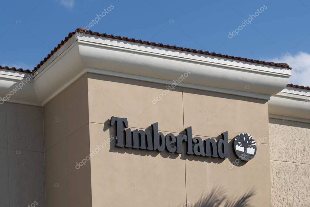 Orlando, Florida, USA - January 20, 2022: The Timberland store sign on the building at a shopping mall is shown. Timberland LLC is an American manufacturer and retailer of outdoor footwear.
