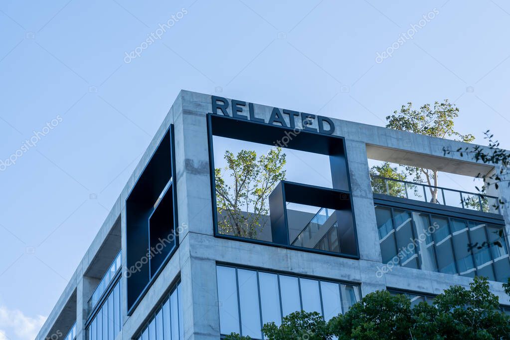 Coconut Grove, FL, USA - January 2, 2022: Related Group sign on top of their headquarters building in Coconut Grove, FL, USA. The Related Group is an American real estate development company.