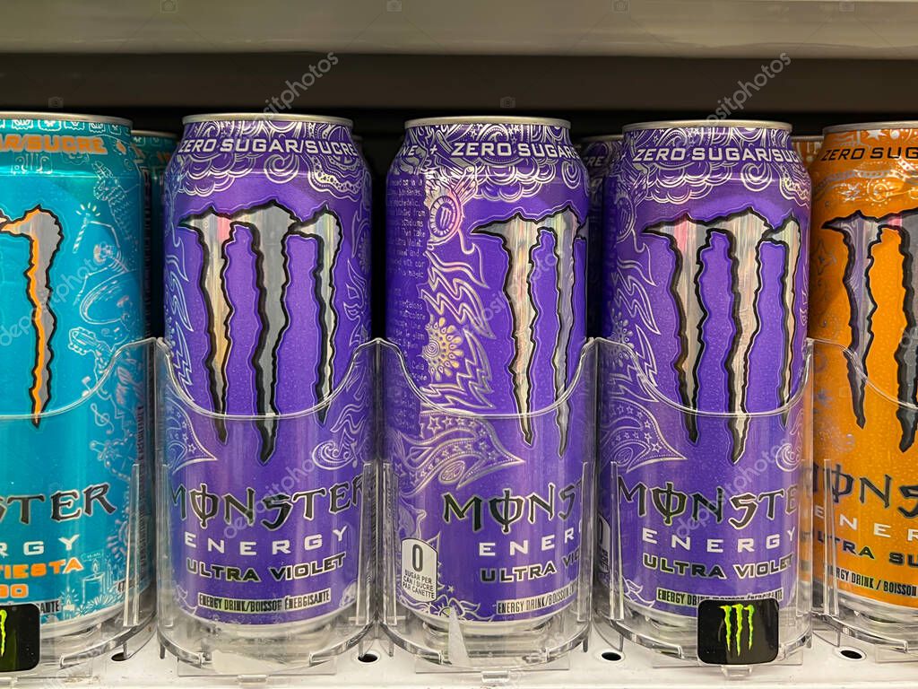 Calgary, Alberta, Canada - July 18, 2023: Variety of Monster Energy Drink cans for sale on the shelves in a supermarket. Calgary, Alberta, Canada.