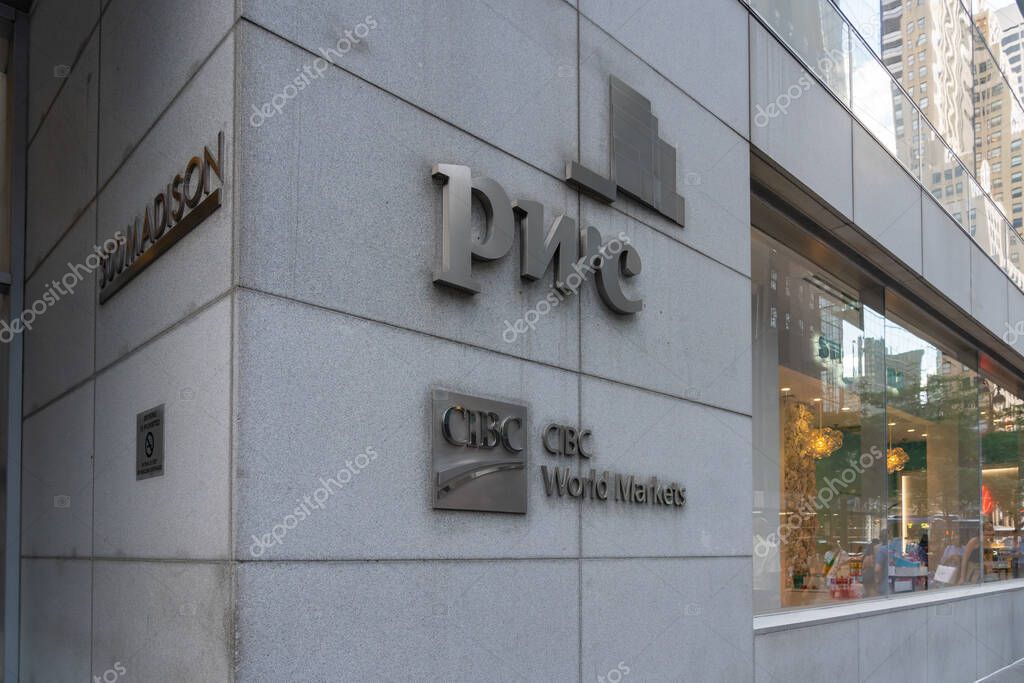 New York City, USA - August 18, 2022: PricewaterhouseCoopers (PwC) and CIBC World Markets logos on the office building on Madison Ave. in New York City.