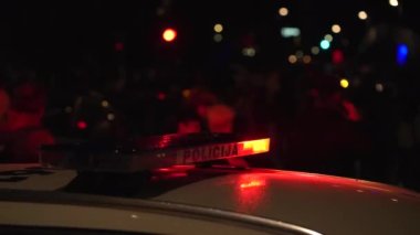 Blue light flasher on top of a police car.