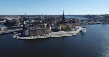 Stockholm Downtown in Sweden. Island with Riddarholmen Church Roof in Background. 4k Drone