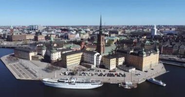 Stockholm Downtown in Sweden. Island with Riddarholmen Church Roof in Background. 4k Drone