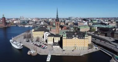 Stockholm Downtown in Sweden. Island with Riddarholmen Church Roof in Background. 4k Drone