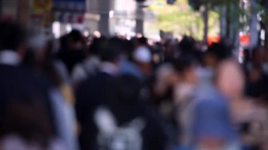 Blurry Japanese People in Tokyo. Business District. Rush Hour Time People Are Walking on the Sidewalk. Japan