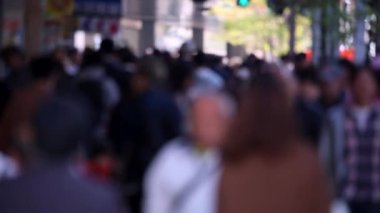 Blurry Japanese People in Tokyo. Business District. Rush Hour Time People Are Walking on the Sidewalk. Japan