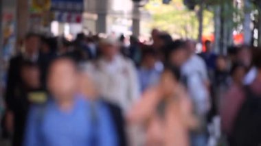 Blurry Japanese People in Tokyo. Business District. Rush Hour Time People Are Walking on the Sidewalk. Japan