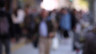 Blurry Japanese People in Tokyo. Business District. Rush Hour Time People Are Walking on the Sidewalk. Japan