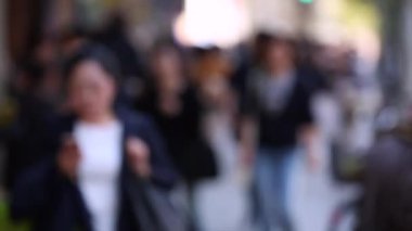 Blurry Japanese People in Tokyo. Business District. Rush Hour Time People Are Walking on the Sidewalk. Japan