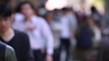 Blurry Japanese People in Tokyo. Business District. Rush Hour Time People Are Walking on the Sidewalk. Japan