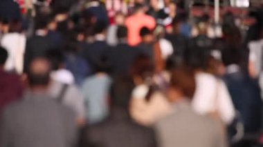 Blurry People Are Crossing the Street in Tokyo Shinjuku Area. Business District. Rush Hour Time