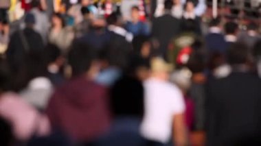 Blurry People Are Crossing the Street in Tokyo Shinjuku Area. Business District. Rush Hour Time