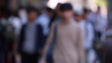 Blurry People in City. Business District. Rush Hour Time People Are Walking on the Sidewalk. Asian People