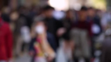 Blurry People in City. Business District. Rush Hour Time People Are Walking on the Sidewalk. Asian People