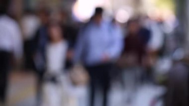 Blurry People in City. Business District. Rush Hour Time People Are Walking on the Sidewalk. Asian People