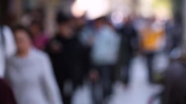 Blurry People in City. Business District. Rush Hour Time People Are Walking on the Sidewalk. Asian People