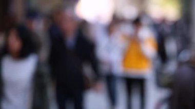 Blurry People in City. Business District. Rush Hour Time People Are Walking on the Sidewalk. Asian People