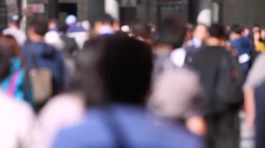 Blurry People in Tokyo City. Business District. Rush Hour Time People Are Walking on the Sidewalk. Japanese People