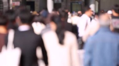 Blurry People in Tokyo City. Business District. Rush Hour Time People Are Walking on the Sidewalk. Japanese People