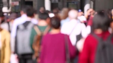 Blurry People in Tokyo City. Business District. Rush Hour Time People Are Walking on the Sidewalk. Japanese People