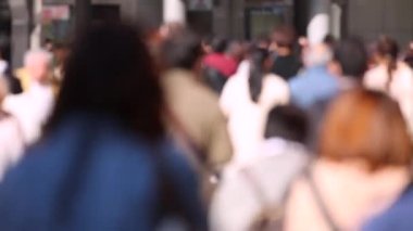 Blurry People in Tokyo City. Business District. Rush Hour Time People Are Walking on the Sidewalk. Japanese People