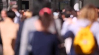 Blurry People in Tokyo City. Business District. Rush Hour Time People Are Walking on the Sidewalk. Japanese People