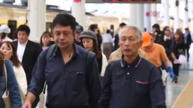 Metro Train Station Platform in Tokyo. Underground Metro Train Station During Rush Hour. People Leaving Station and Walking on Platform. Asian commuters traveling.
