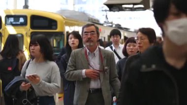 Metro Train Station Platform in Tokyo. Underground Metro Train Station During Rush Hour. Seibu Haijima Line Train and People. Asian commuters traveling.