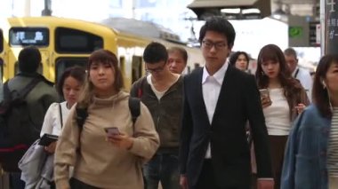 Metro Train Station Platform in Tokyo. Underground Metro Train Station During Rush Hour. Seibu Haijima Line Train and People. Asian commuters traveling.