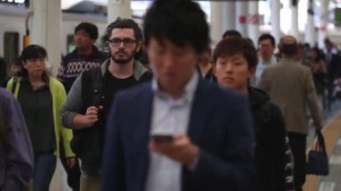 Metro Train Station Platform in Tokyo. Underground Metro Train Station During Rush Hour. Seibu Train Station. People Leaving Station and Walking on Platform. Asian commuters traveling.