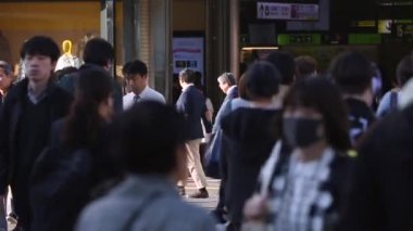 People Waiting Till Can Cross The Street in Tokyo City. Business District. Rush Hour Time. Japanese People. Shinjuku District in Tokyo. Blurry Background